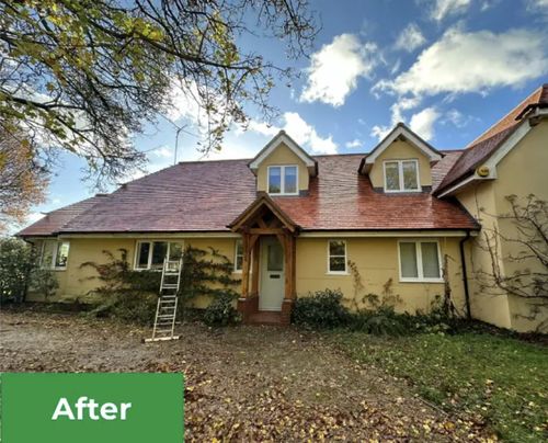 Same house after roof cleaning with tiles fully restored to original colour